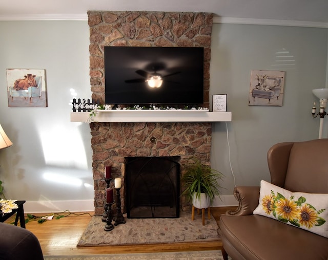 living room featuring a fireplace, hardwood / wood-style floors, and ornamental molding