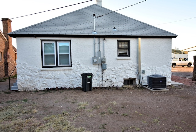 back of property with central air condition unit