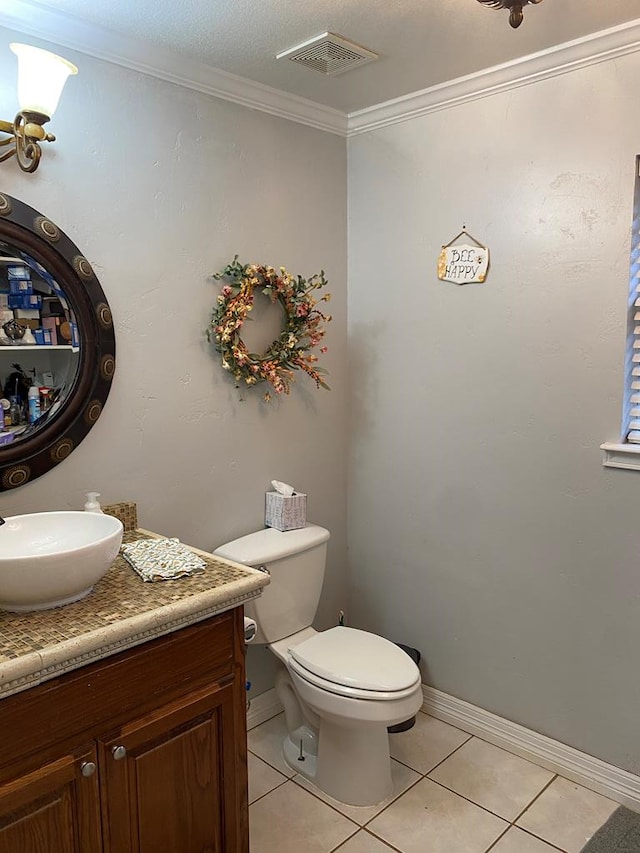 bathroom featuring crown molding, toilet, tile patterned flooring, and vanity