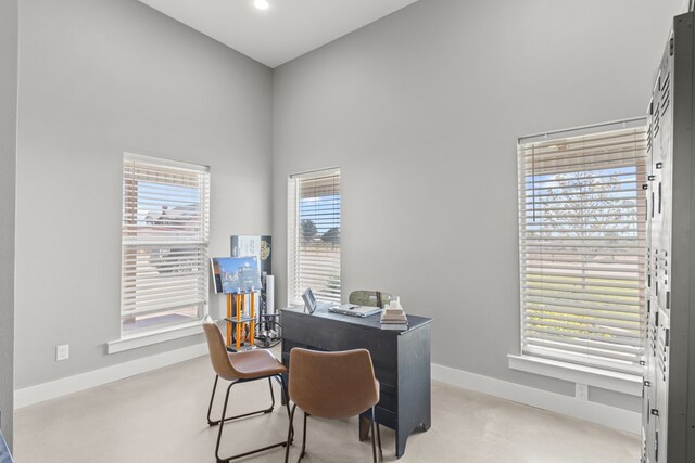 home office featuring a high ceiling