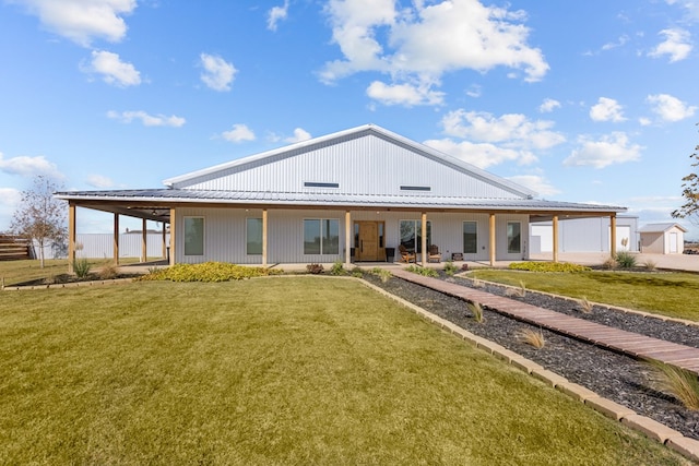 back of house featuring a yard