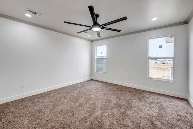 carpeted empty room with crown molding, recessed lighting, baseboards, and visible vents