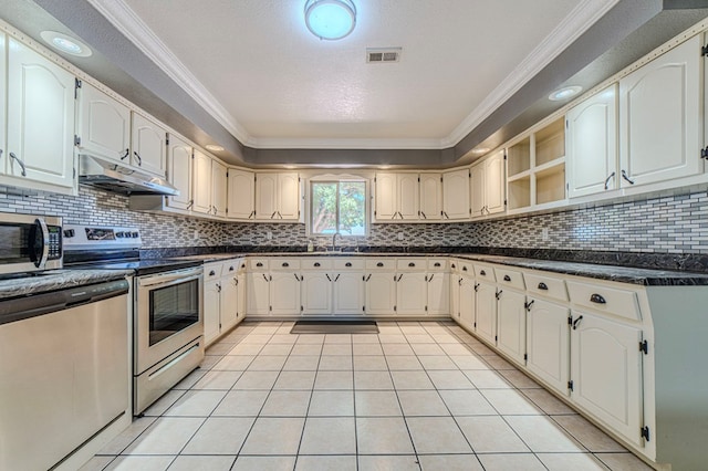 kitchen featuring stainless steel appliances, sink, ornamental molding, and light tile patterned floors