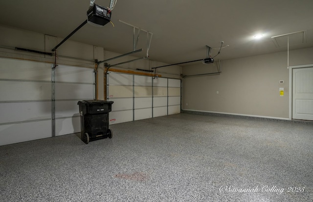 garage featuring a garage door opener