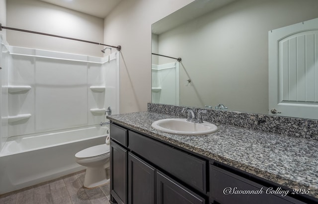 full bathroom featuring vanity,  shower combination, and toilet