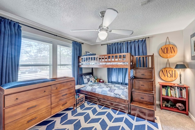 bedroom featuring light carpet and a textured ceiling