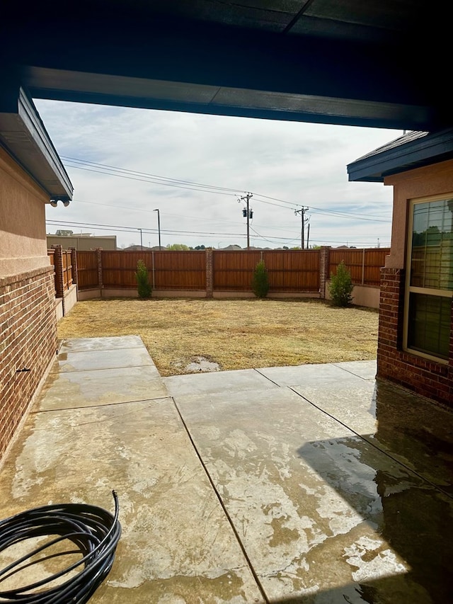 view of yard featuring a patio area and a fenced backyard