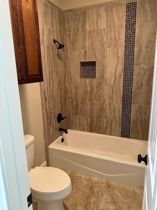 full bathroom featuring toilet and shower / bath combination