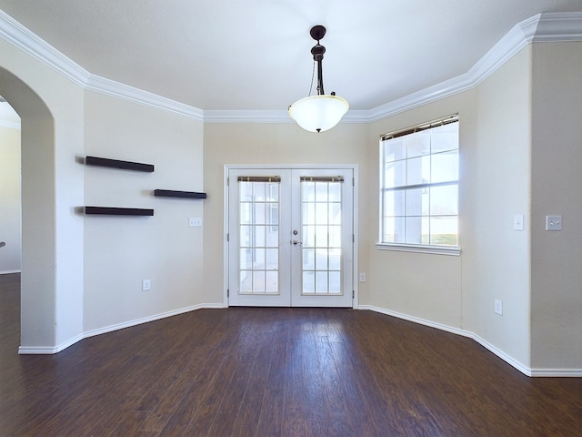 interior space with arched walkways, baseboards, french doors, ornamental molding, and dark wood-style floors