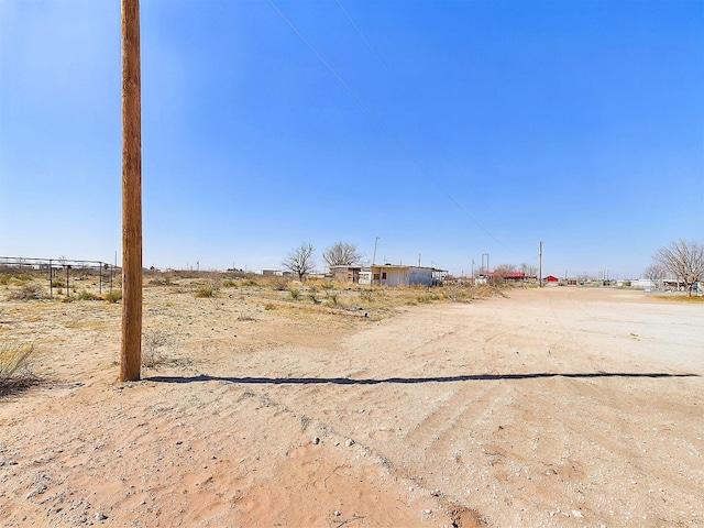 view of yard with a rural view