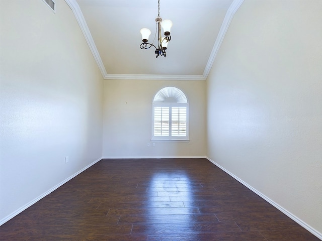 spare room with ornamental molding, baseboards, and dark wood-style floors