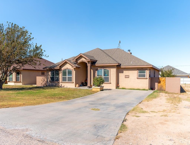 ranch-style home with a front yard