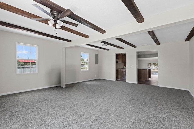 unfurnished living room with baseboards, beam ceiling, ceiling fan, and carpet flooring