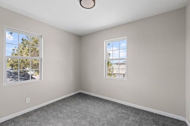 spare room with carpet flooring and baseboards