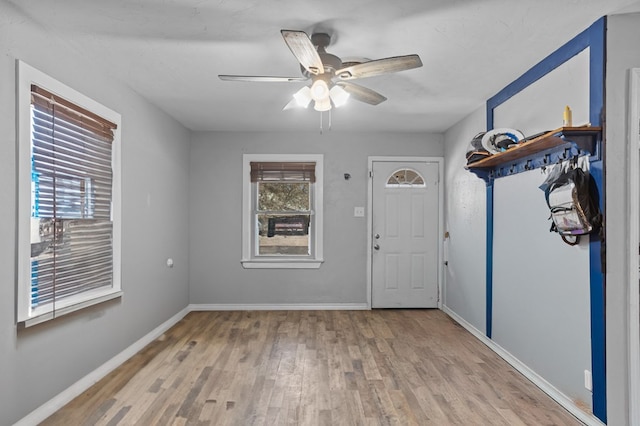 entrance foyer featuring wood finished floors, baseboards, and ceiling fan