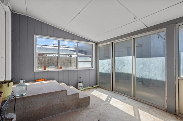 unfurnished sunroom with lofted ceiling