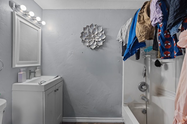 full bath with toilet, vanity, and shower / bath combination