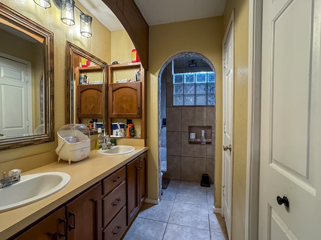 bathroom with tile patterned floors and vanity