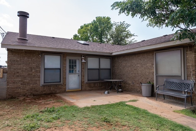 rear view of property with a patio area