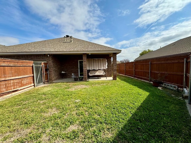 rear view of property featuring a lawn