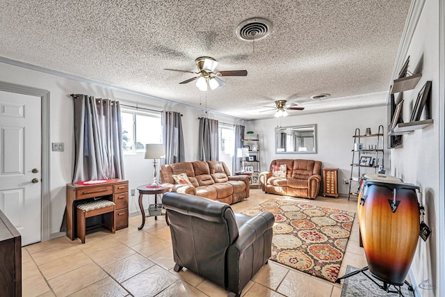 living room featuring ceiling fan and a textured ceiling