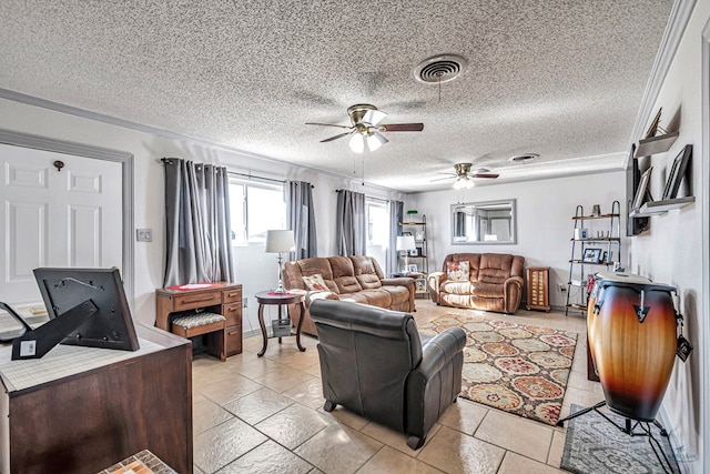 living room with ceiling fan and a textured ceiling