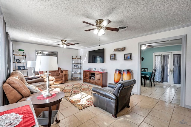 living room featuring crown molding, ceiling fan, plenty of natural light, and a textured ceiling