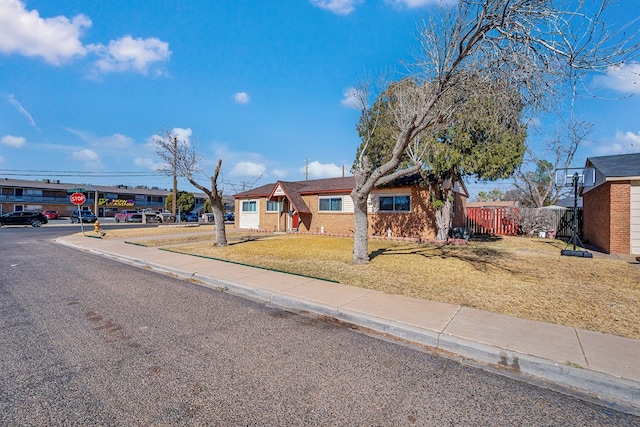 ranch-style home with a front yard