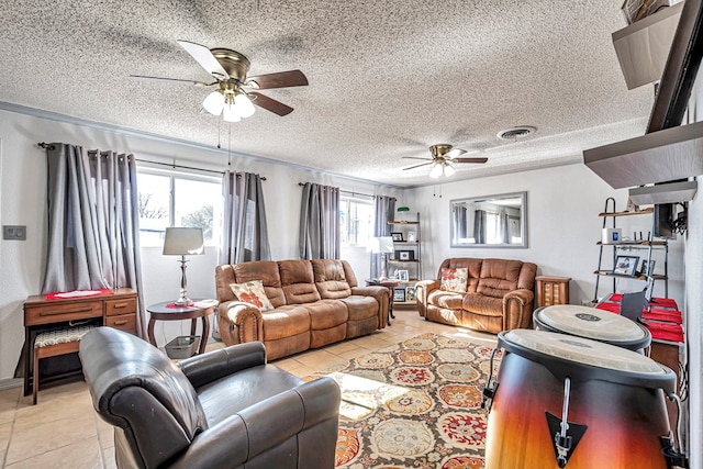 tiled living room with a textured ceiling and ceiling fan