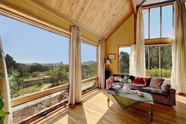 sunroom featuring vaulted ceiling with beams and wood ceiling