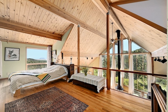 bedroom featuring wooden ceiling, light hardwood / wood-style flooring, and lofted ceiling with beams