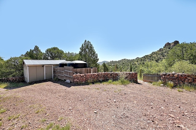 view of yard with a storage shed