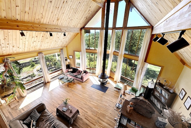 living room with beam ceiling, wooden ceiling, high vaulted ceiling, and wood-type flooring