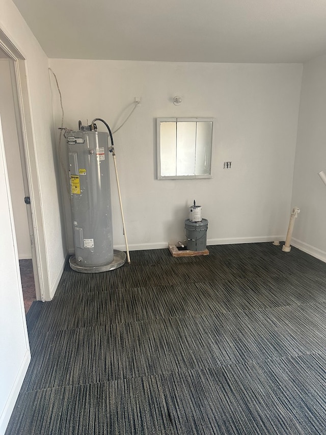 utility room featuring electric water heater