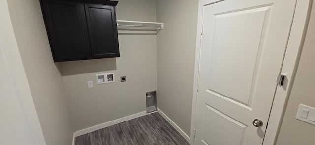 washroom featuring electric dryer hookup, dark wood-type flooring, washer hookup, cabinet space, and baseboards