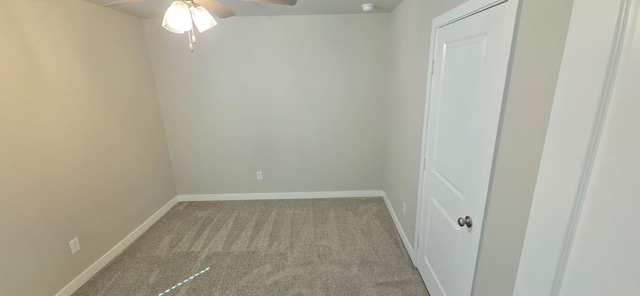 unfurnished room with baseboards, carpet, and ceiling fan