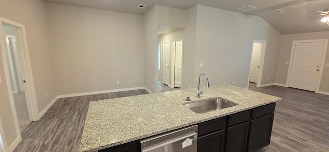 kitchen featuring dishwasher, open floor plan, dark wood-style flooring, and a sink