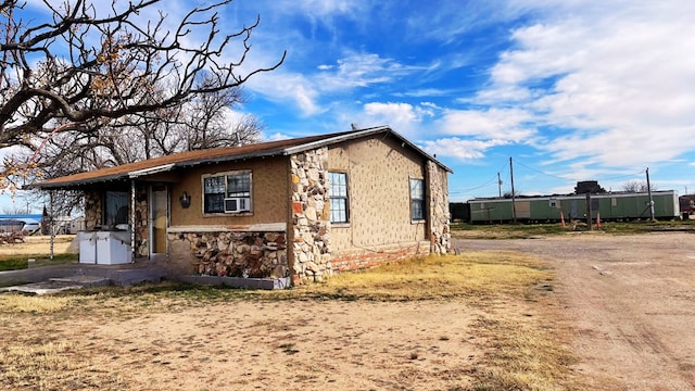 view of home's exterior with cooling unit