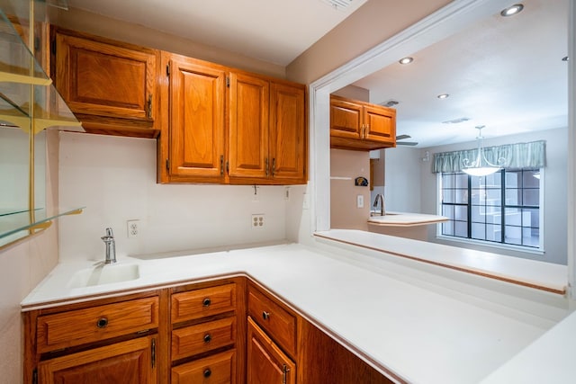 kitchen featuring sink and decorative light fixtures