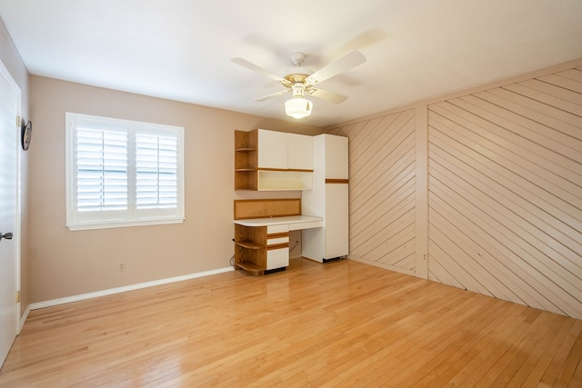 unfurnished bedroom with ceiling fan and light hardwood / wood-style flooring