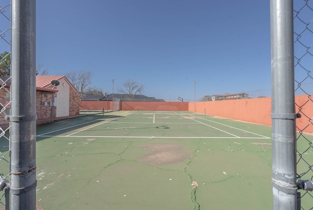 view of tennis court with basketball court