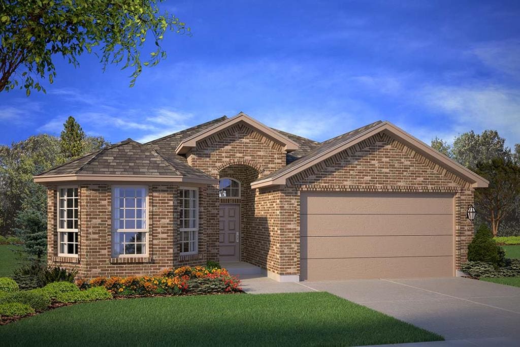 view of front of home with a garage and a front lawn