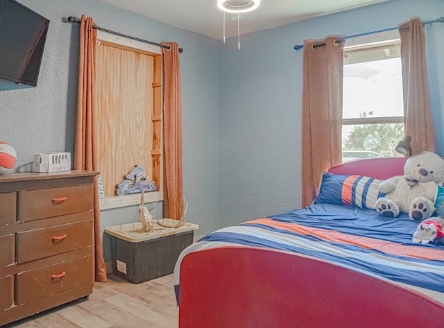 bedroom with light hardwood / wood-style flooring