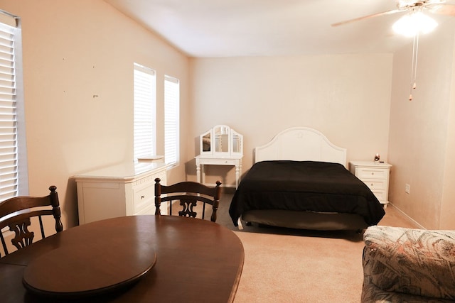 bedroom with light colored carpet and ceiling fan