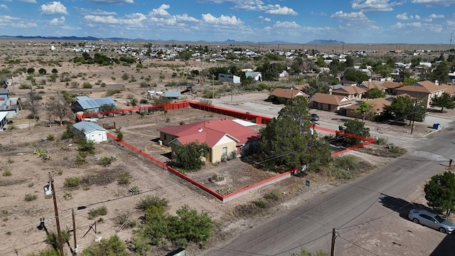 birds eye view of property featuring a mountain view