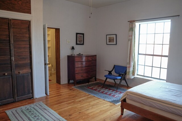 exercise room with ceiling fan and a textured ceiling