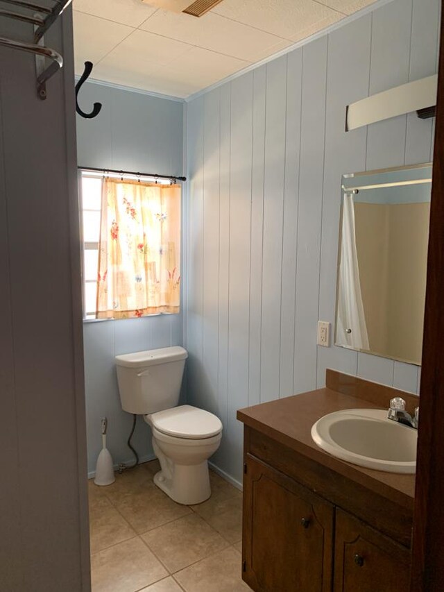 unfurnished bedroom featuring hardwood / wood-style floors and crown molding