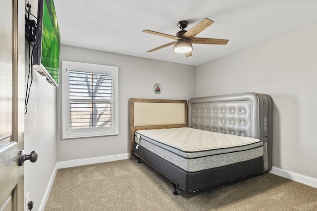 bedroom featuring ceiling fan and light colored carpet