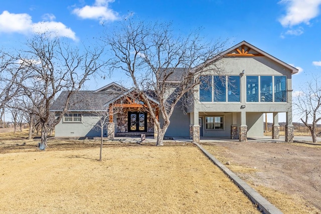 view of front of house with a sunroom