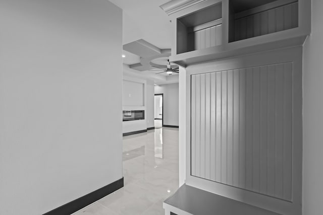 hall featuring beamed ceiling and coffered ceiling